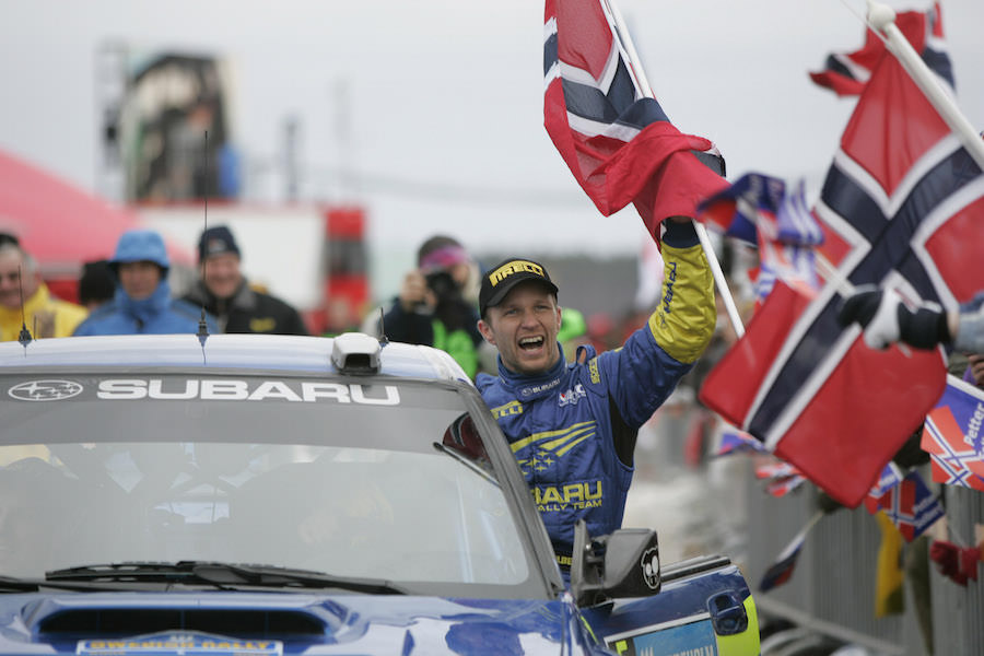 Subaru driver Petter Solberg celebrates his victory in the Swedish Rally 2005 on his way into final service.
