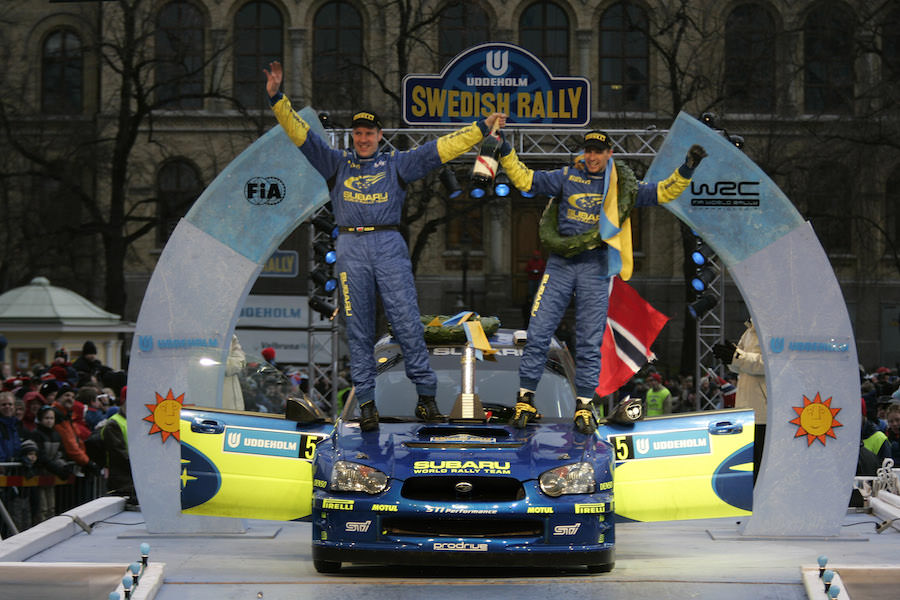 Subaru driver Petter Solberg and co-driver Phil Mills on the finish podium in Karlstad, after winning the 2005 Swedish Rally.